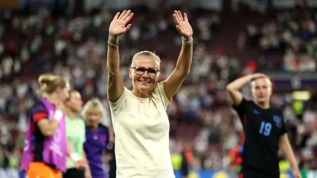 Sarina Wiegman, Head Coach of England, acknowledges the fans at full-time