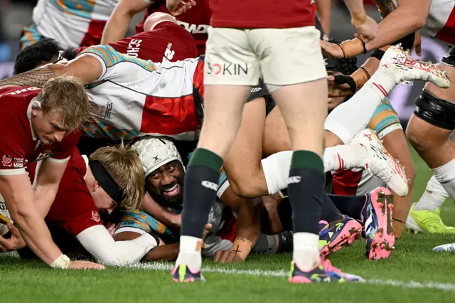 First Nations & Pasifika XV's Seru Uru (C) reacts after scoring a try