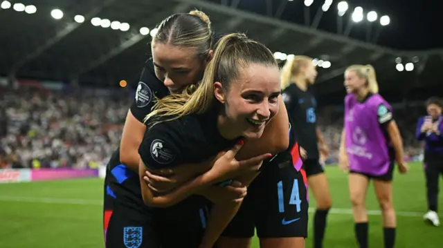 Ella Toone and Grace Clinton of England celebrate victory