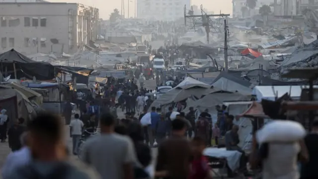 A view of Palestinians gathering to collect aid supplies
