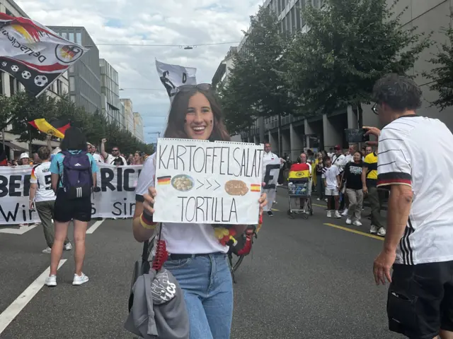 Fan holding sign
