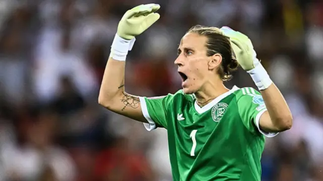Germany's goalkeeper #01 Ann-Katrin Berger reacts
