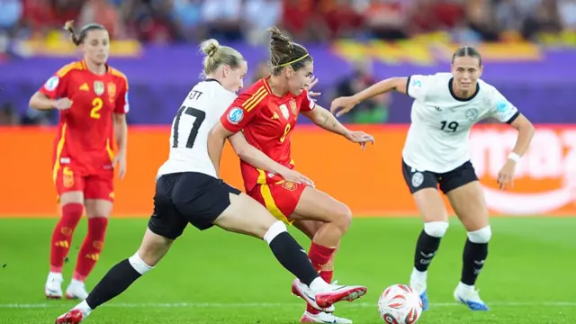 Franziska Kett of Germany (L) and Klara Buhl of Germany (R) defend against Mariona Caldentey of Spain (C)