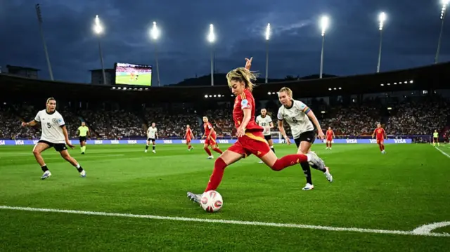 Spanish player striking the ball