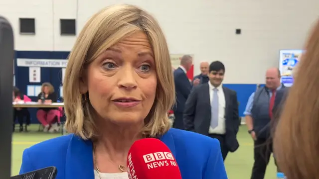 Diana Armstong in a blue blazer