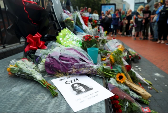 Flowers laid at the Black Sabbath bench on Broad Street, Birmingham. A drawing of Ozzy Osbourne has also been placed on the beach with the words: "Love from all your fans worldwide."