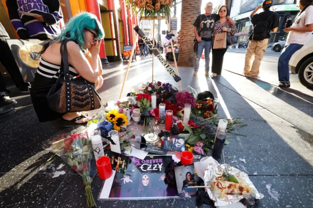 Candles and flowers on Ozzy's star