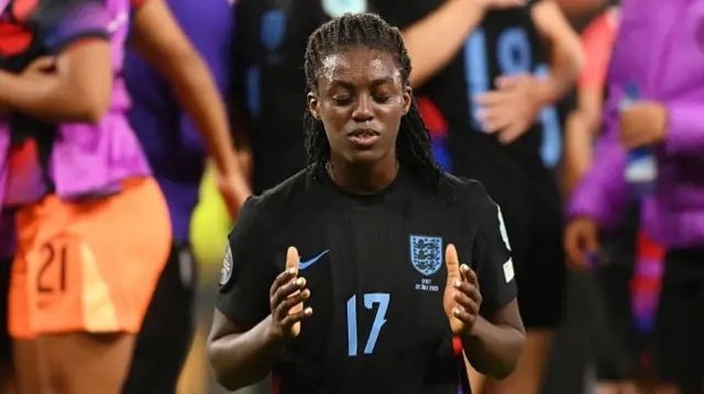 Michelle Agyemang prays following England's victory over Italy