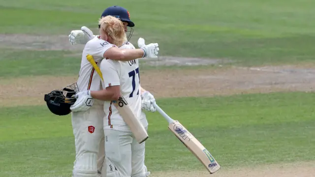 Jordan Cox and Matt Critchley hug
