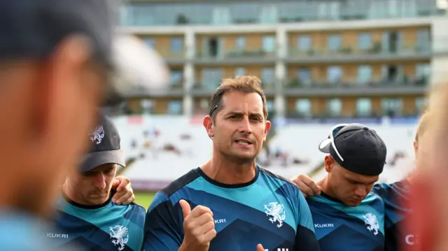 Somerset head coach Jason Kerr in a huddle before a T20 game