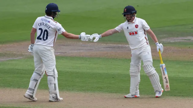 Jordan Cox and Matt Critchley shake hands on their 100 stand