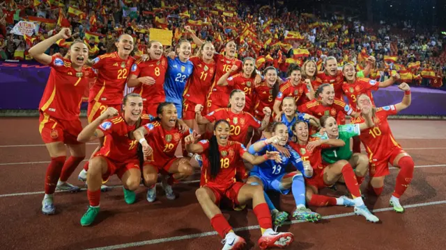 Spain players celebrate victory in front of their fans