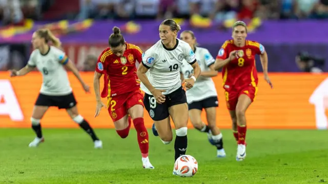 Klara Buhl of Germany (R) controls the ball under pressure