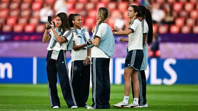 Spain's players walk on the pitch during the pitch inspection