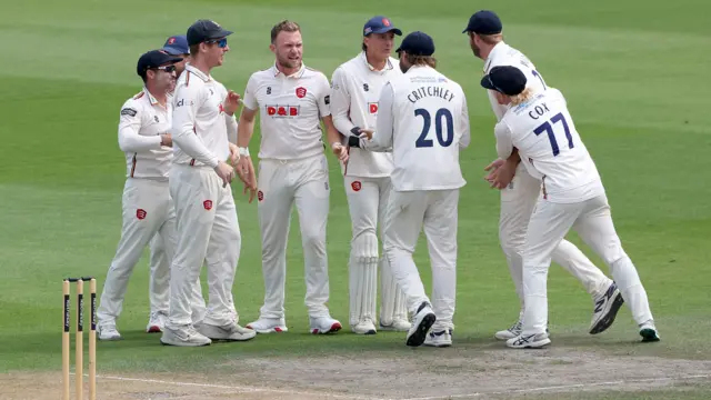 Essex celebrate with wicket-taker Sam Cook