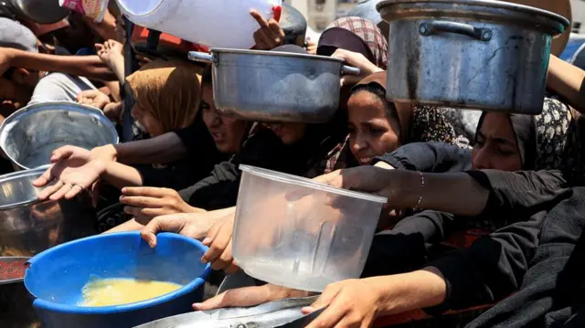 People linking up with buckets, bowls and containers.