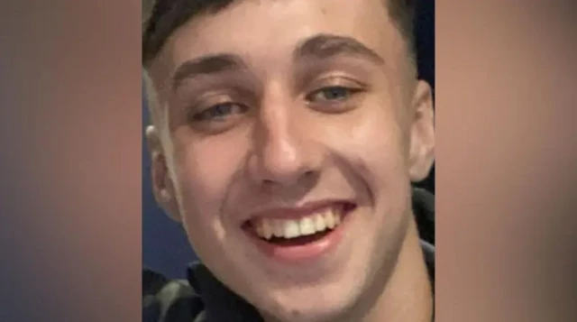 A close-up image of Jay Slater smiling into the camera