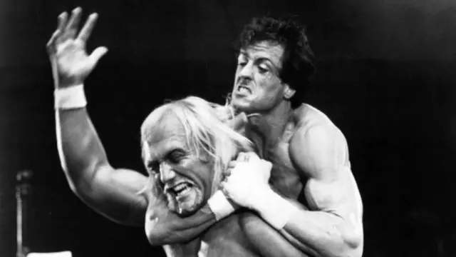 Hulk Hogan on the set of Rocky III with Sylvester Stallone, where Stallone has Hogan in a headlock