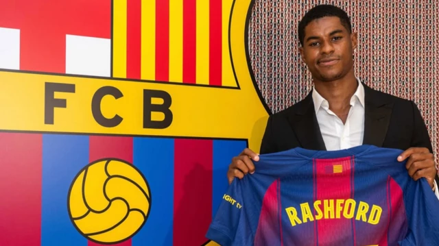 Rashford poses with new Number 14 Barcelona shirt