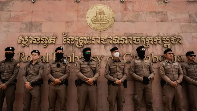 Thai police stand guard outside the Royal Embassy of Cambodia in Bangkok during a demonstration over tensions at the Thai-Cambodian border