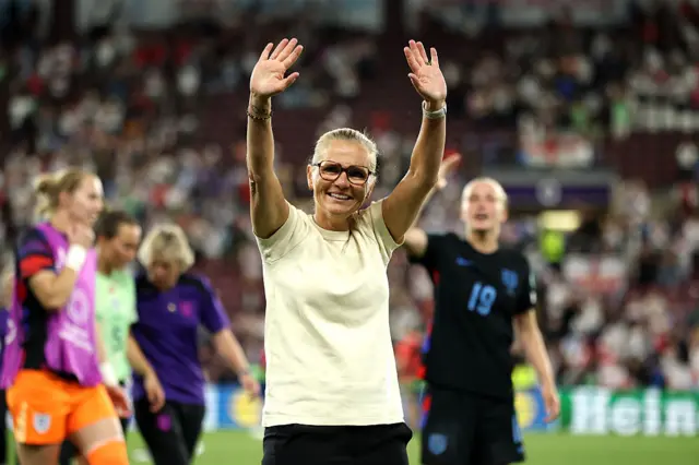 Sarina Wiegman with her hands in the air