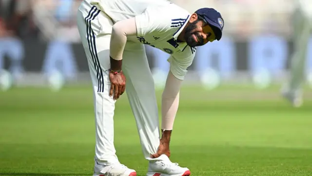 Jasprit Bumrah feels an injured ankle at Old Trafford.