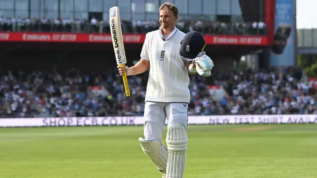 Joe Root walks off the pitch after being dismissed with 150 runs v India at Old Trafford.
