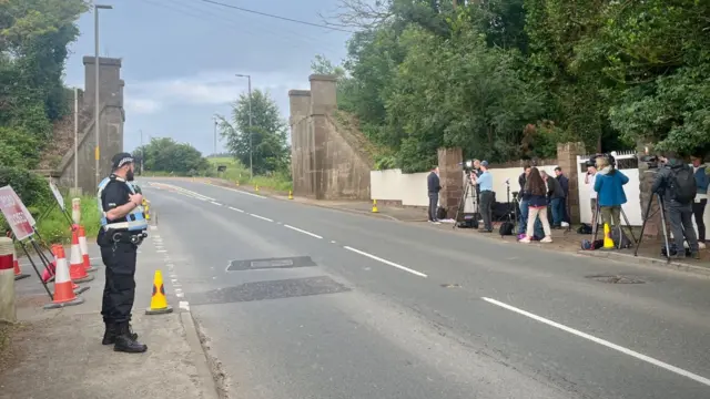 Media stand along a street outside Turnberry golf resort