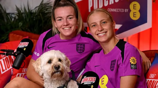 Lauren Hemp and Aggie Beever-Jones on the Lionesses podcast with Reggie the dog