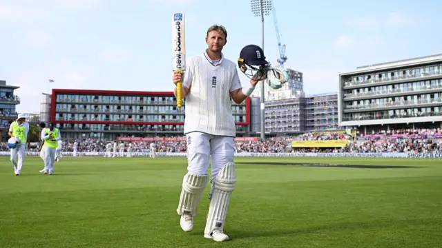 Joe Root thanks the crowd as he leaves the field after being dismissed for 150 runs at Old Trafford v India.