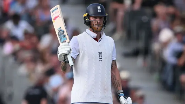 Ben Stokes lifts his bat to thank the crowd after hitting 50 v India.