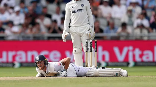 Ben Stokes looks up from the floor after hitting a boundary at Old Trafford.