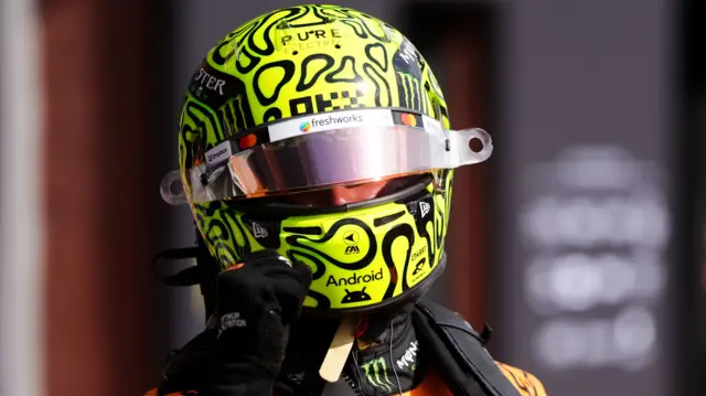 Lando Norris celebrates after getting pole at Belgian GP qualifying at Spa.