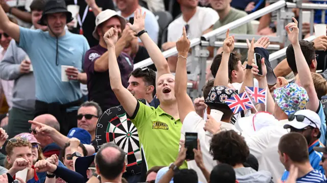 A man dressed as darts player Michael van Gerwen