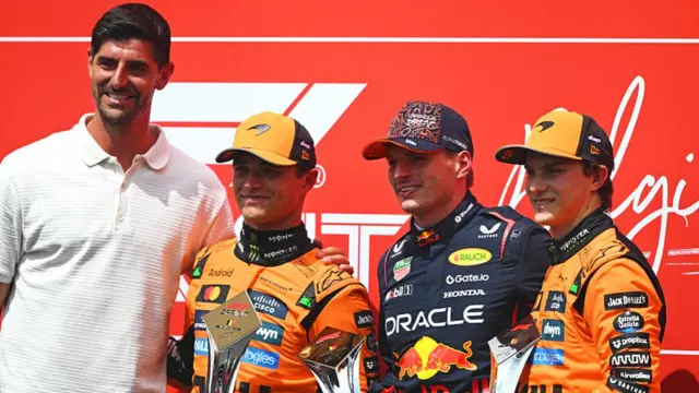 Thibaut Courtois poses for photos with the sprint top three at Spa - Lando Norris, Max Verstappen and Oscar Piastri