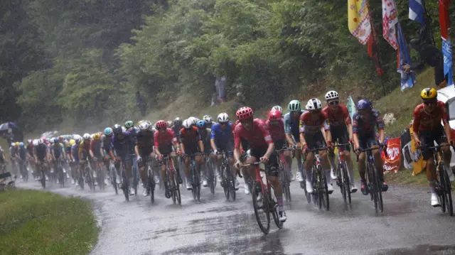 Rain falls on riders during stage 20 of the Tour de France