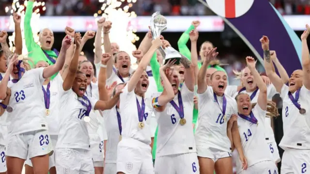 Leah Williamson and Millie Bright of England lift the trophy after their teams victory during the UEFA Women's Euro 2022 final match between England and Germany at Wembley Stadium