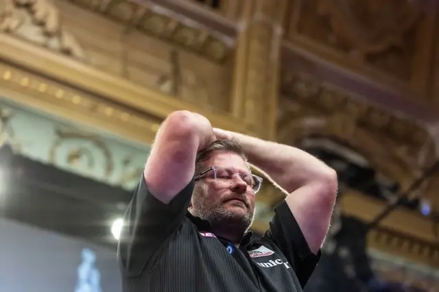 James Wade reacts after beating Jonny Clayton