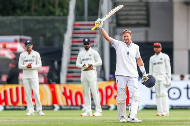 Joe Root salutes the crowd after reaching 150