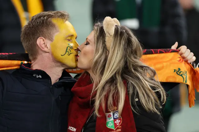 Spectators kiss ahead of the second test