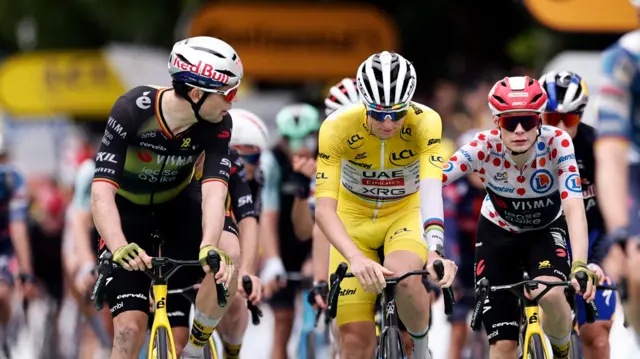 Wout Van Aert crosses the finish line on stage 20 of the 2025 Tour de France with Tadej Pogacar and Jonas Vingegaard