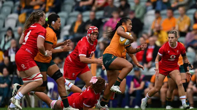 Trilleen Pomare of the Wallaroos is tackled
