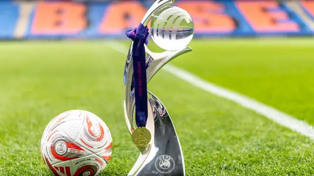 A detailed view of the UEFA Women's EURO 2025 trophy, medal and match ball at St. Jakob-Park