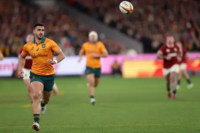 Australia's Tom Wright runs to grab the ball