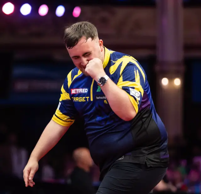 Luke Littler celebrates after winning a leg