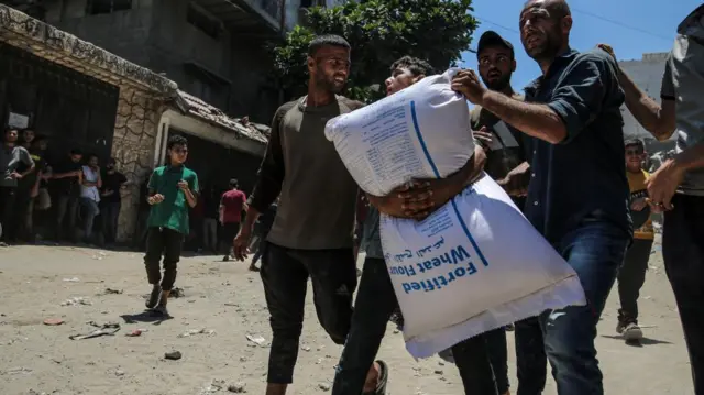 World Food Programme aid packages are distributed after successfully arriving at the organization's warehouses in Gaza City