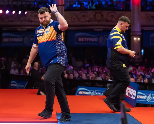 Josh Rock celebrates after winning a leg