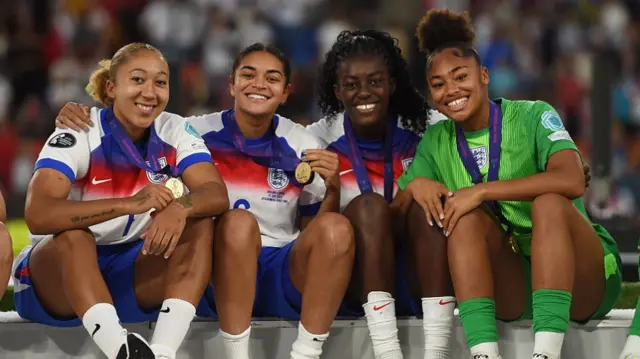 Lauren James, Jess Carter, Michelle Agyemang and Khiara Keating of England pose for a photo as they celebrate their victory in the UEFA Women's EURO 2025 Final match between England and Spain