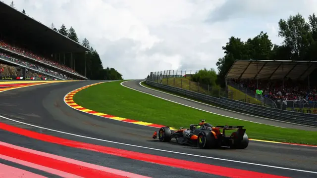 Lando Norris approaches Eau Rouge at Spa.
