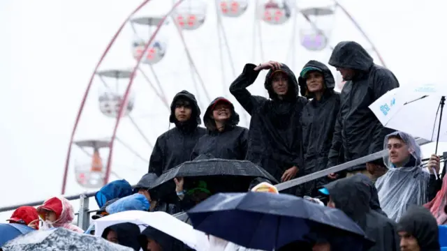 Fans wearing ponchos in the stands before the Grand Prix at Spa.
